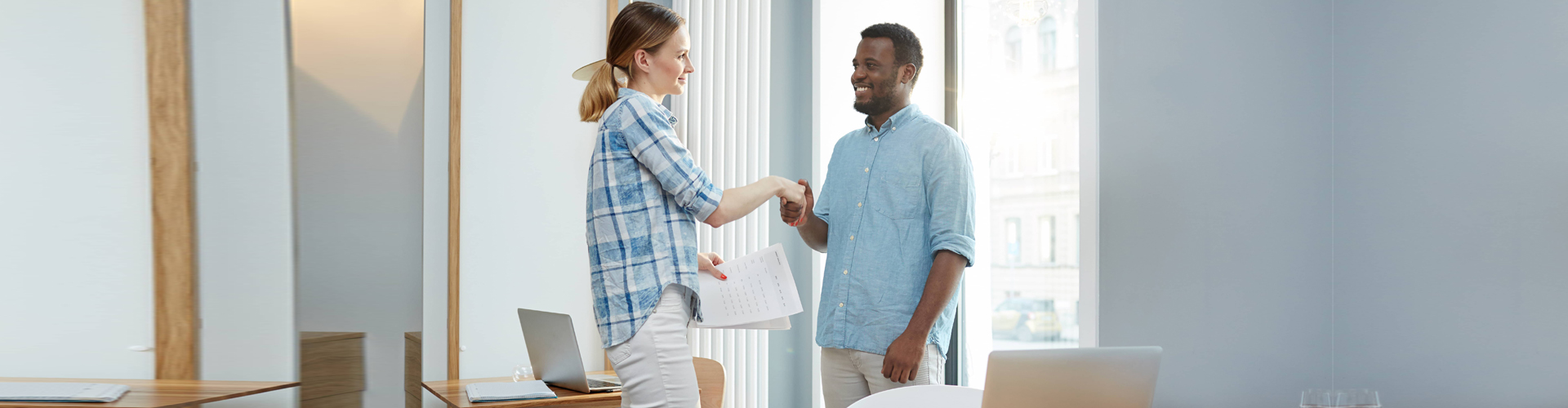 man and woman handshaking