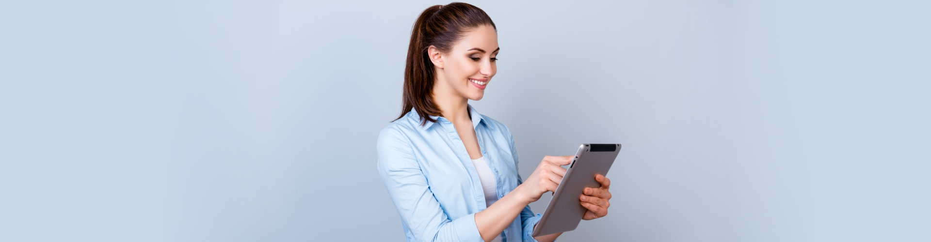 woman using her tablet device